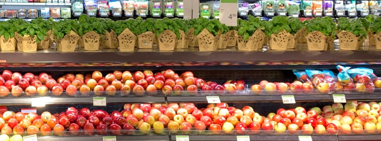 An image representing a particular section of a supermarket store filled with fruits and vegetables.